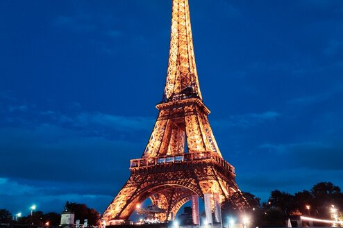The Eiffel Tower lit up at night 